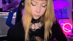 Blonde teen in solo action with her pussy