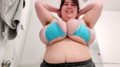 Busty curly brunette with big boobs fucks on couch