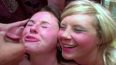 Brunette and blonde having group sex in the living room