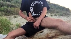 He wanks in the dunes